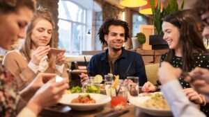 People at table eating Italian food
