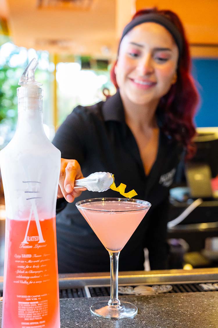 bartender at Aldacos serving drink bartender at Aldacos serving drink