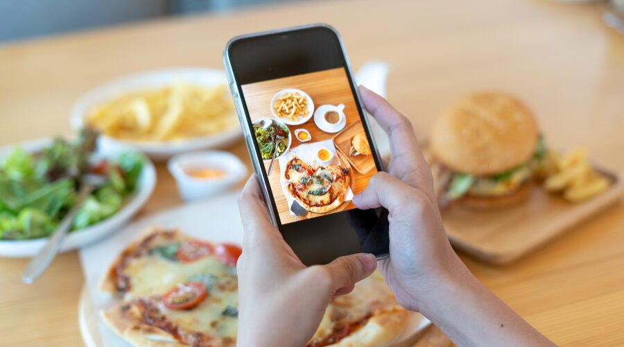 social media marketing image of woman taking pictures of food social media marketing image of woman taking pictures of food
