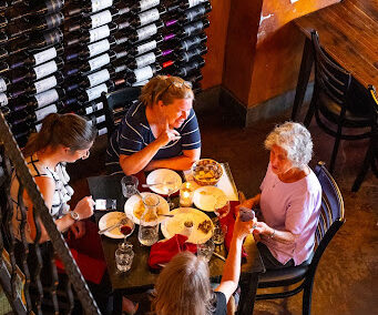 Guests enjoying happy hour at Copa Wine Bar