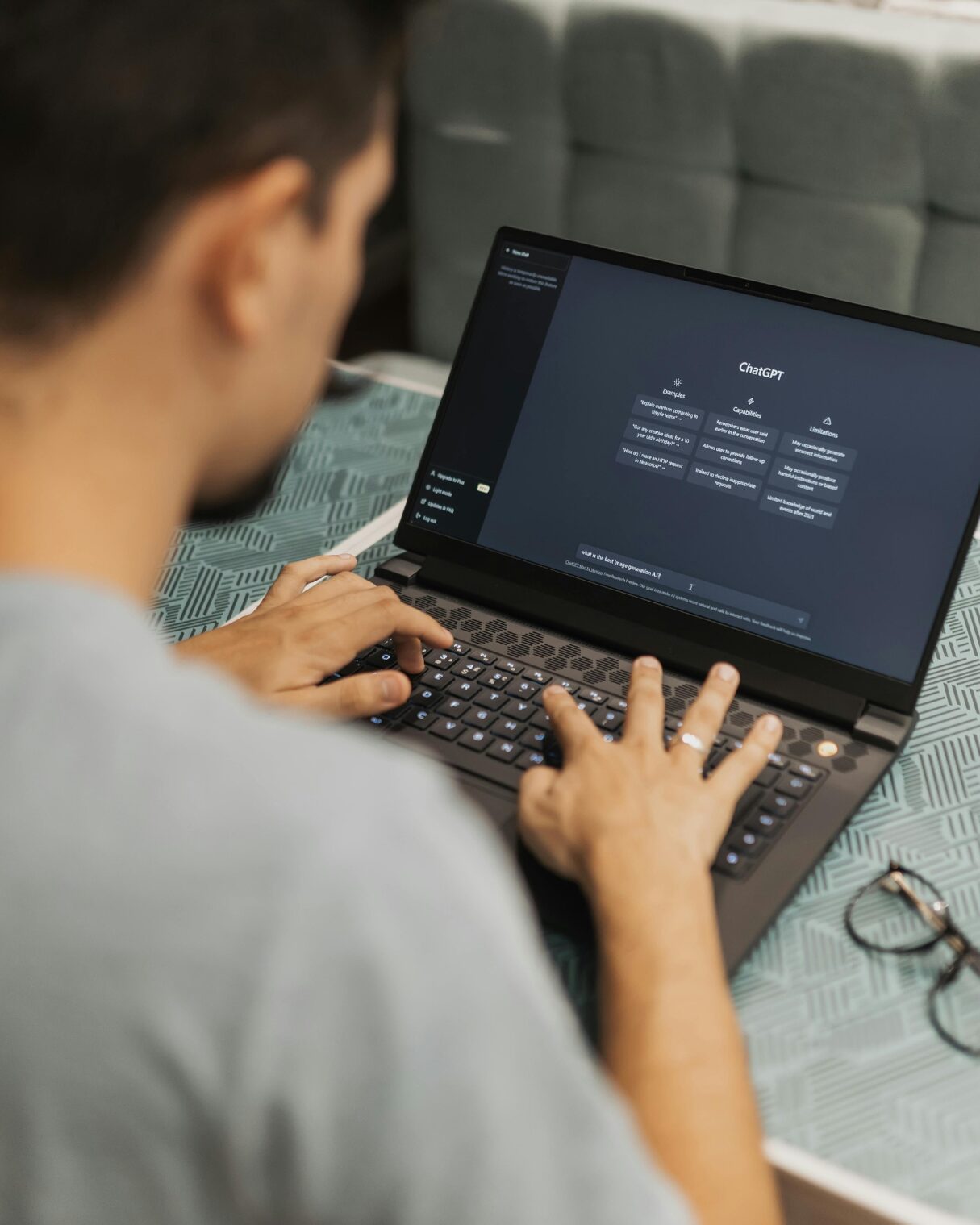 Person using AI on computer Person using AI on computer