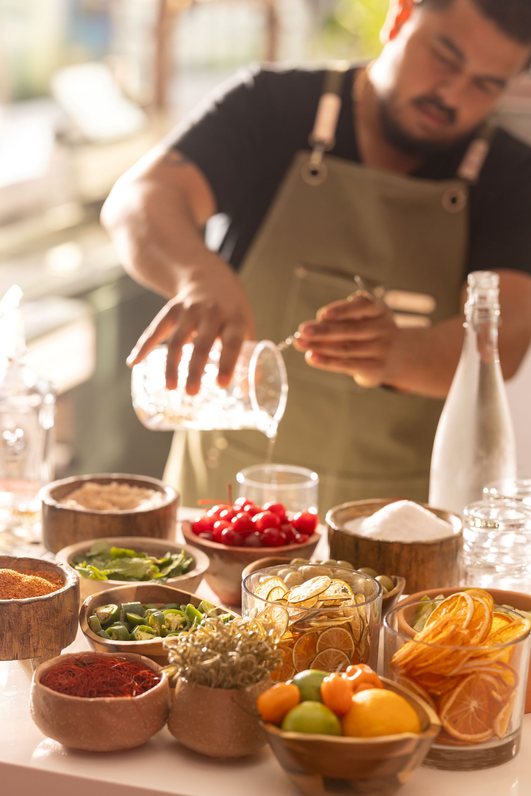 Rosarios Bartender with craft cocktail ingredients